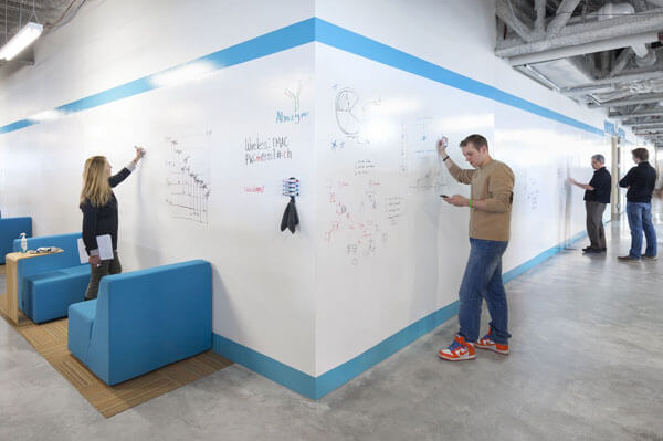 Walls in an office hallway wrapped with 3M Whiteboard Film